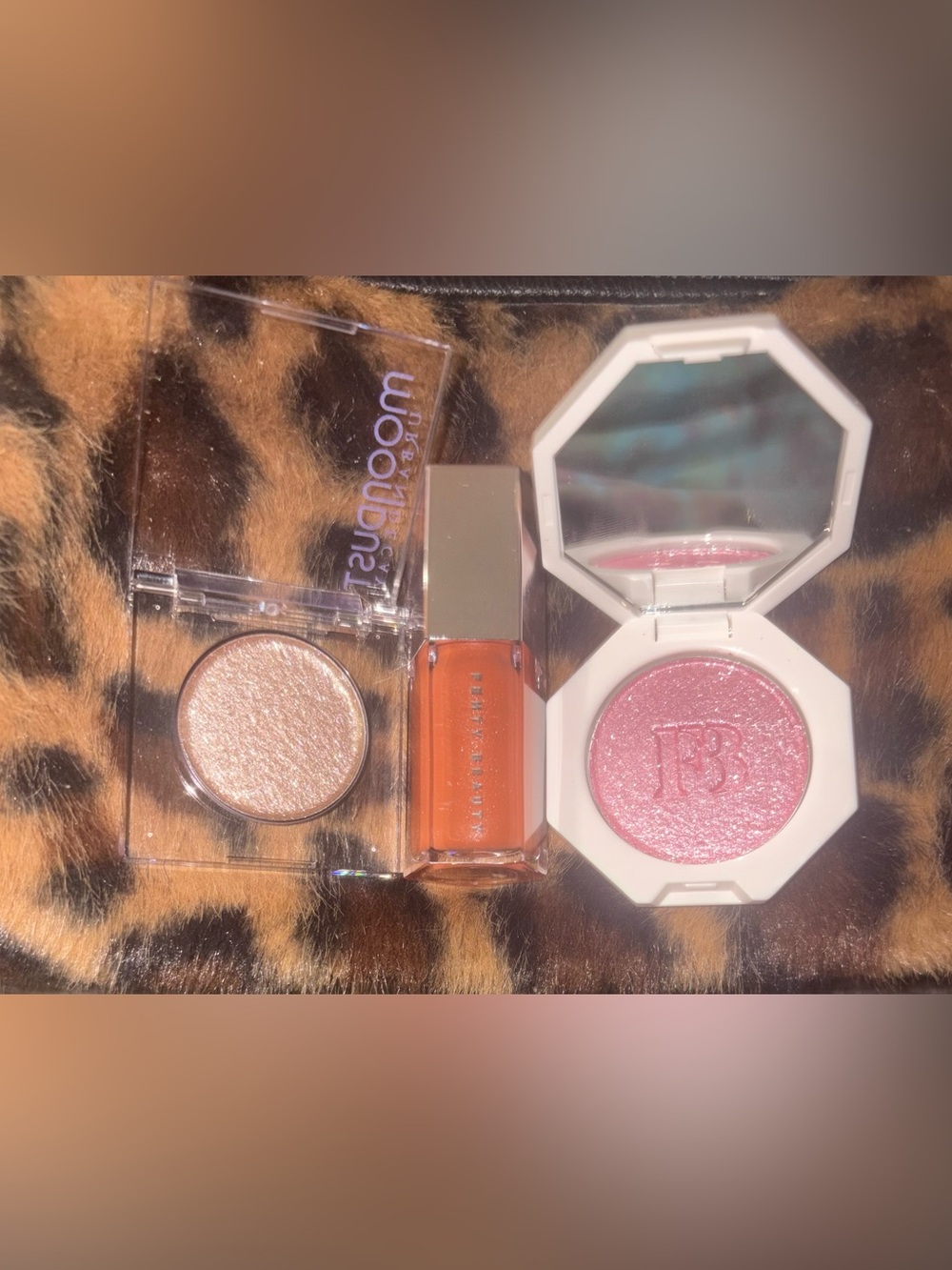 FENTY Beauty Vibrant Orange Lip Gloss with Pink & Champagne Shimmer, Urban Decay